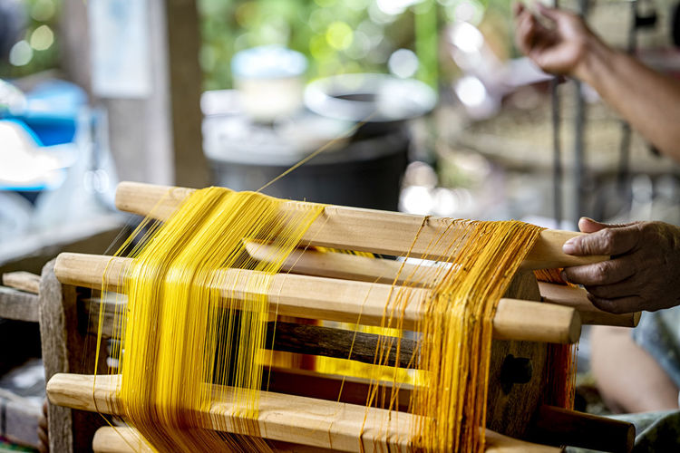Silk raising for silk threads. yarn warping machine in a textile weaving crafsmanship.