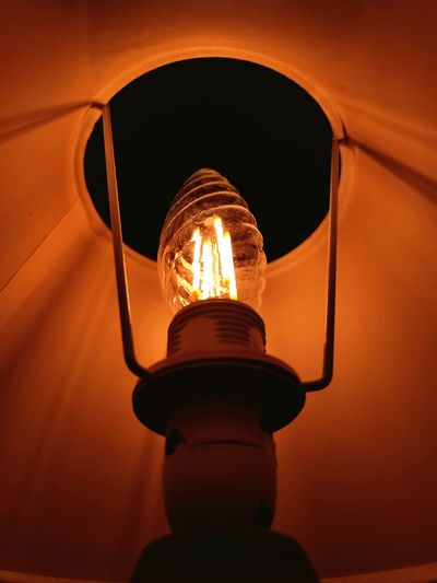 Low angle view of illuminated light bulb