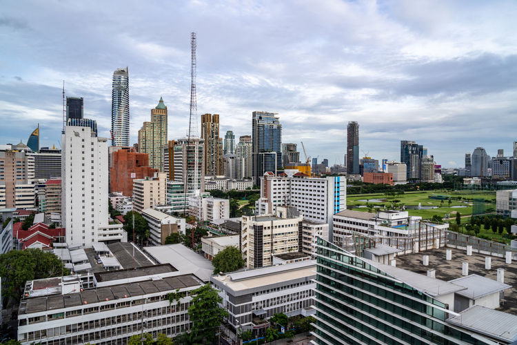 Bangkok, thailand - 10 august 2022 - aerial view of bangkok cityscape high-rises and bts skytrain
