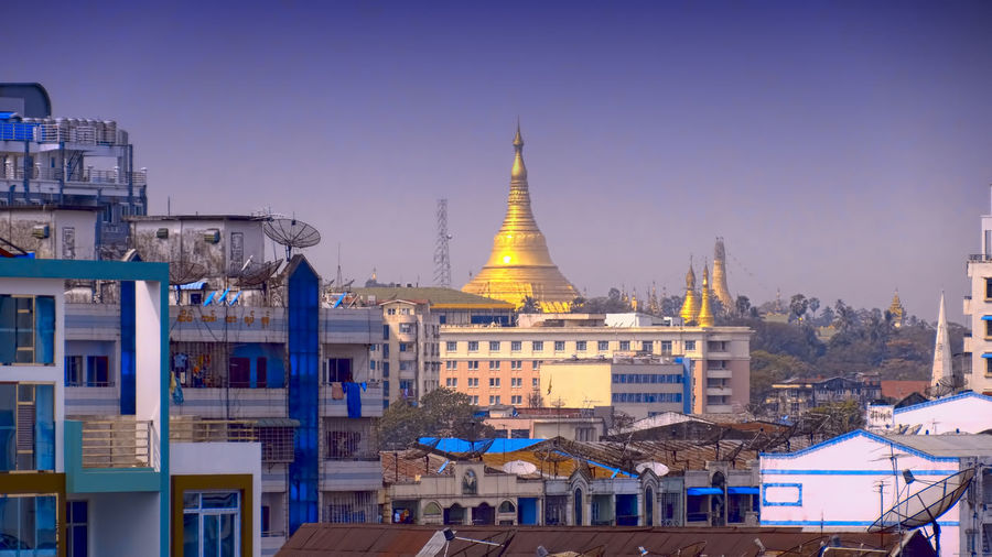 High angle view of buildings and pagoda in city 