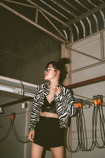 Portrait of thai girl with double bun wearing zebra print top