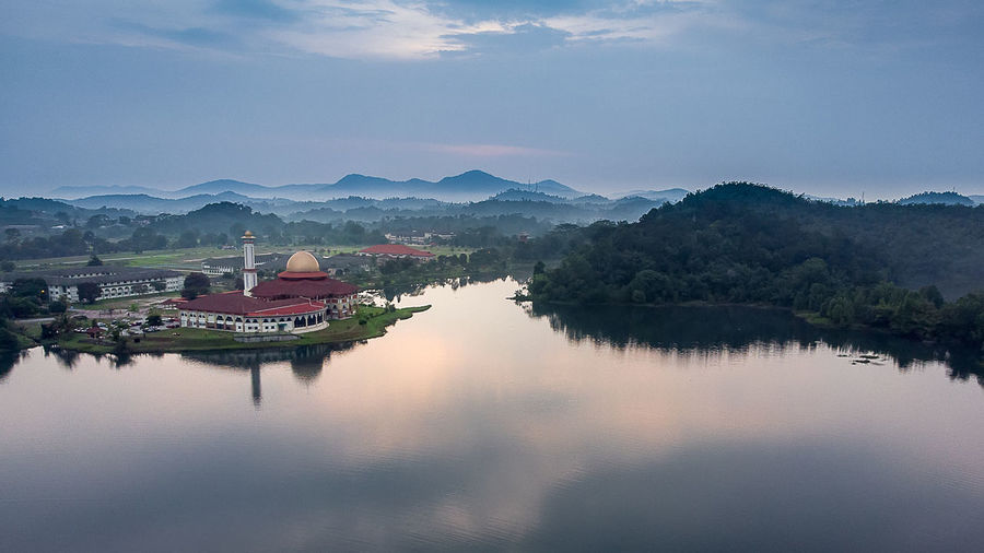 Panoramic view of lake and buildings against sky