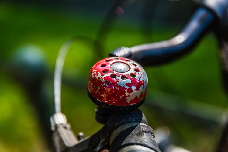 Close-up of red bicycle bell