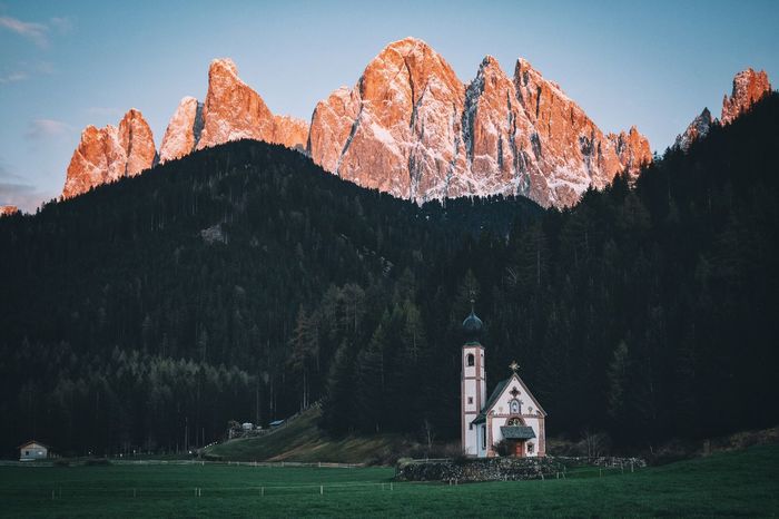 Church against forest and mountain