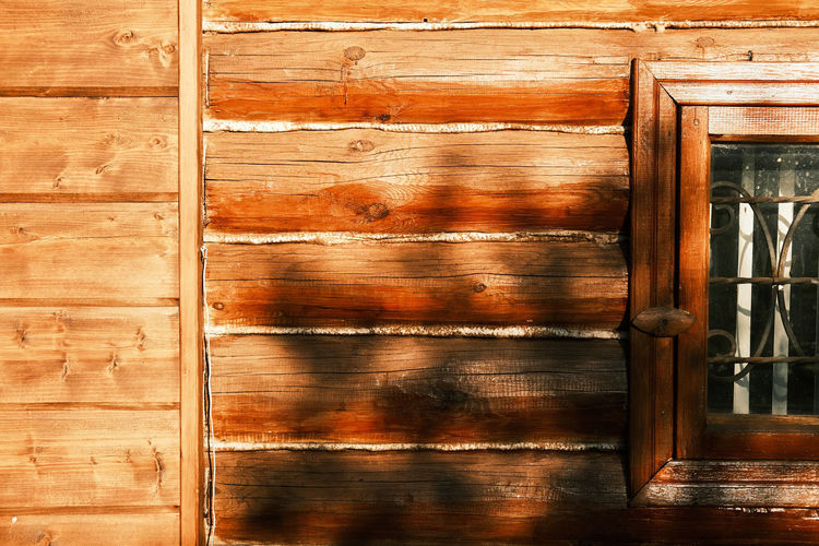 Cropped frame shot of wooden house