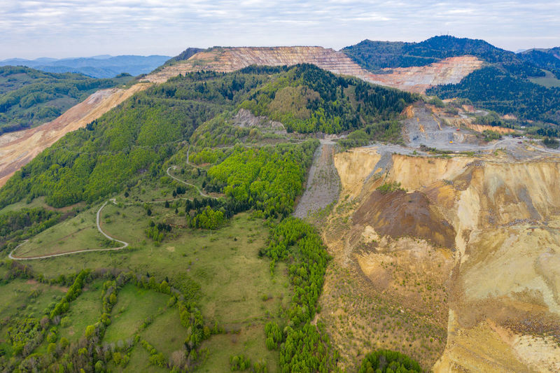 Aerial view of rosia poieni open pit copper mine by drone, romania
