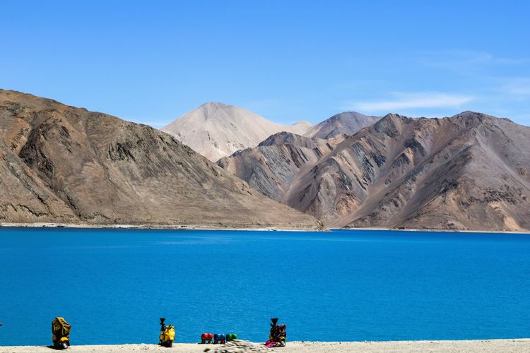 Scenic view of pangong lake against blue sky
