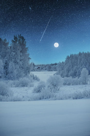 Scenic view of land against sky at night