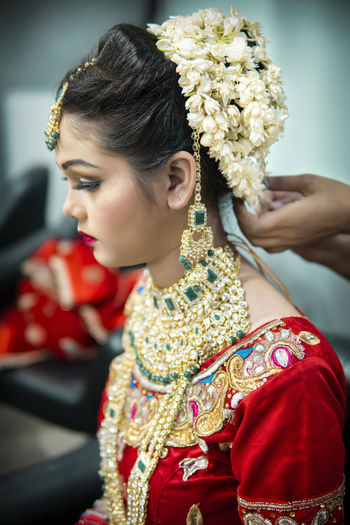 Young bride wearing sari during wedding ceremony