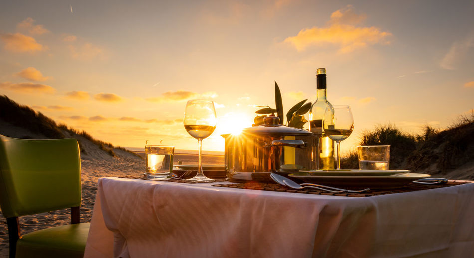View of restaurant table against sky during sunset