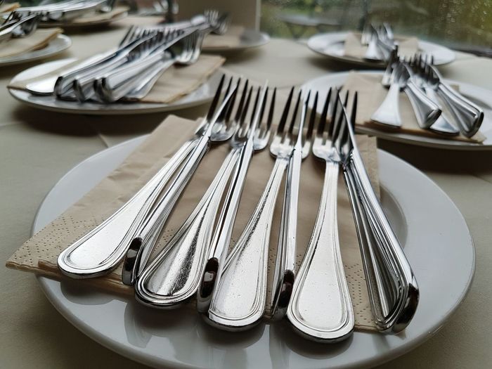 Close-up of fork in plate on table