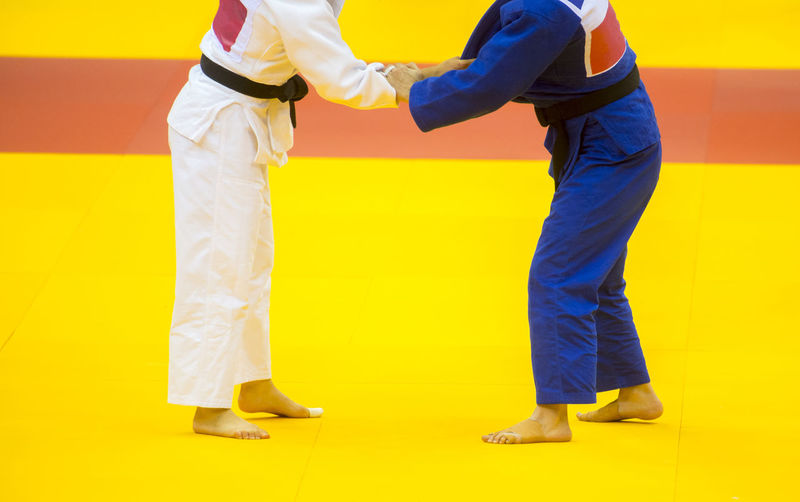 Low section of people practicing judo