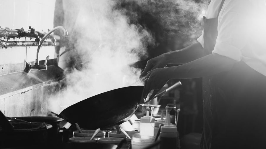 Panoramic shot of man preparing food