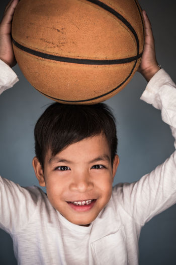Portrait of boy with basketball