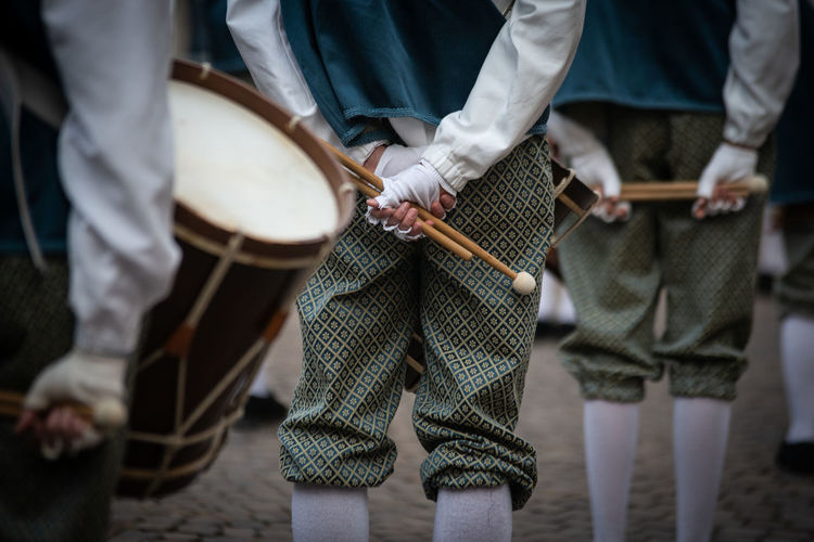 People in uniform with drums