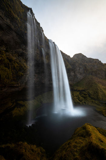 Iconic scenic seljalandsfoss on a cloudy day in autumn in iceland