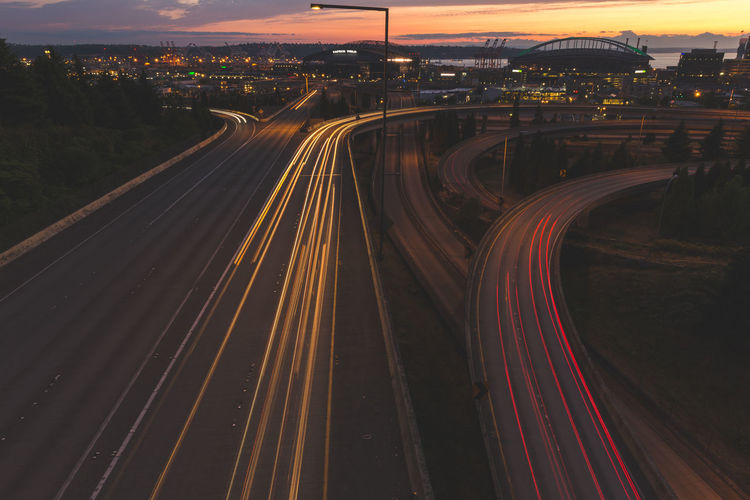 Light trails on road in city at night
