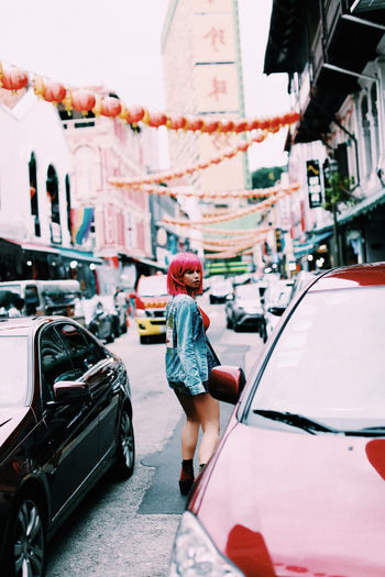 Woman in a pink wig in chinatown, singapore