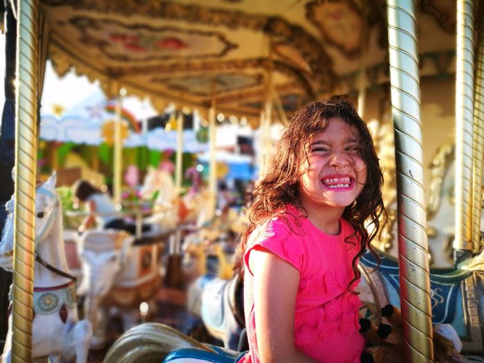Portrait of smiling girl at amusement park