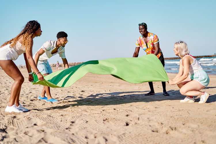 Side view of family at beach