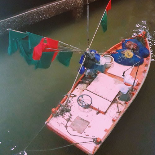 High angle view of multi colored flags on boat in lake