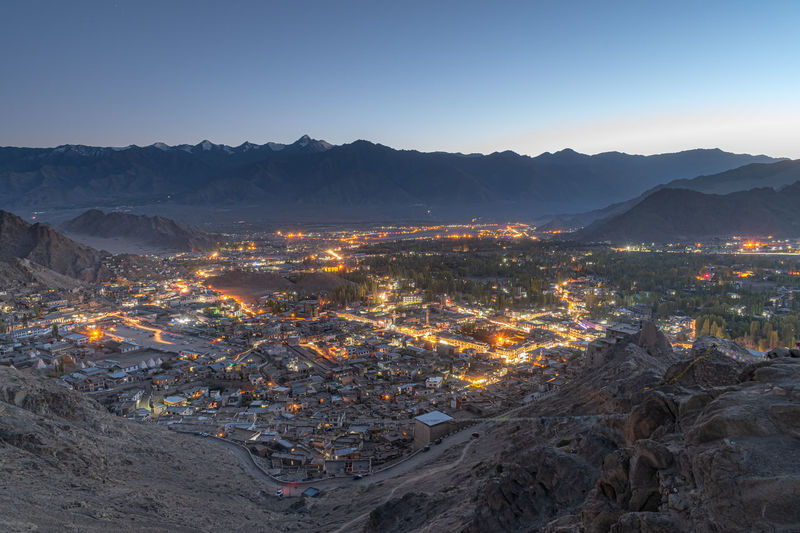 Leh sunset city view with snowcapped mountain range background