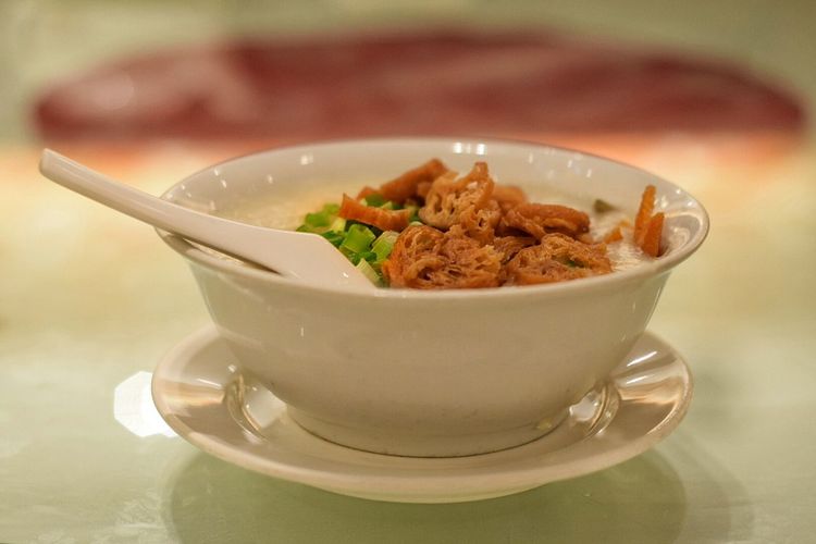 Close-up of congee in bowl on table