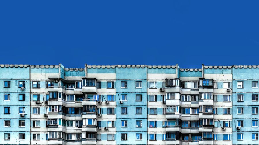 Residential building against blue sky