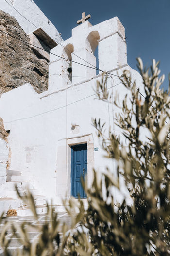 Low angle view of old church, serifos greece cyclades cycladic greek island chora, blue white aegean 