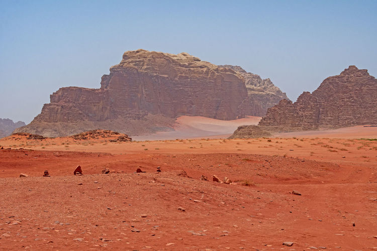 Red sands amongst the desert mountains in wadi rum in jordan