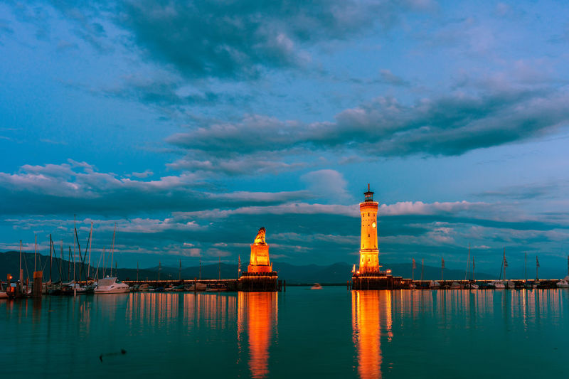 View of the harbor entrance and lighthouse in lindau on lake constance.