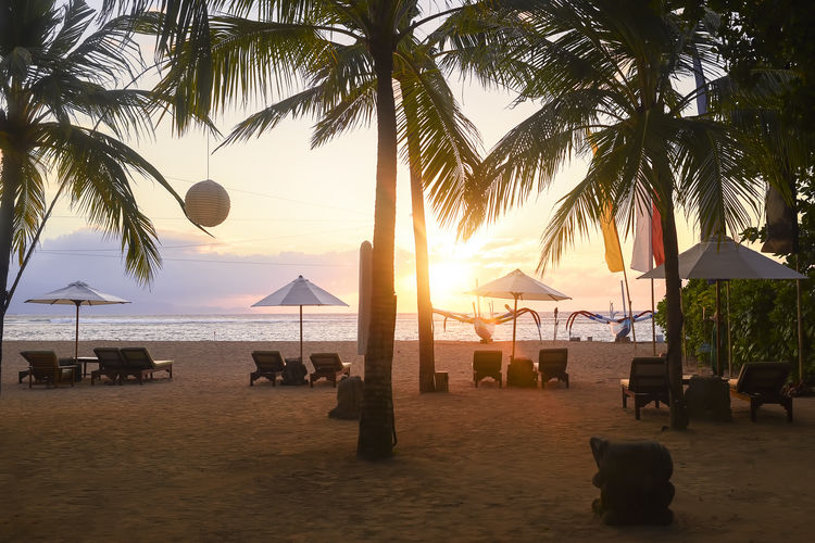 Scenic view of beach against sky during sunset