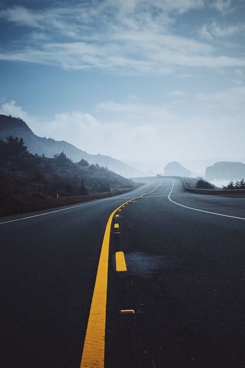 Empty road against sky