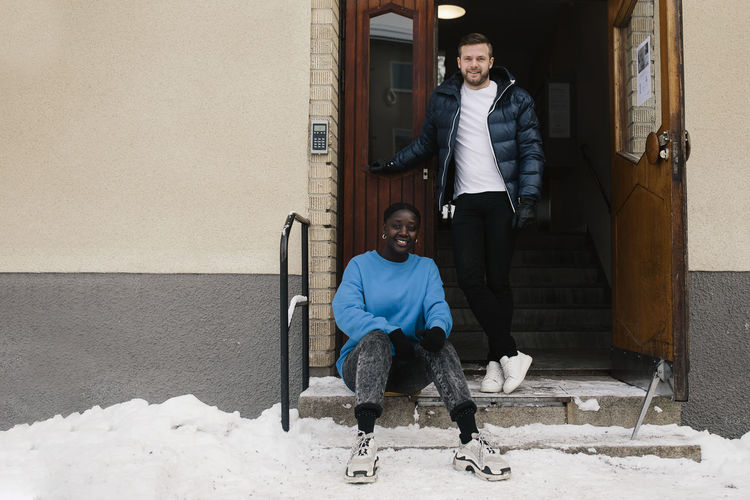 Smiling couple at front door