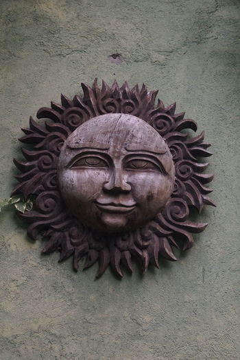 Close-up of statue against wall