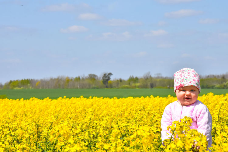 Full length of girl standing on field