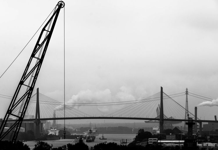 Kohlbrand bridge over river against sky