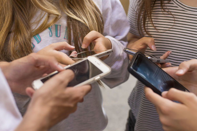 Midsection of woman using mobile phone