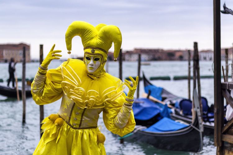 Person in costume by grand canal