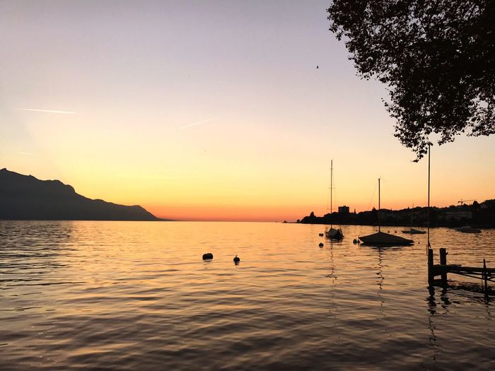 Scenic view of lake against sky during sunset 