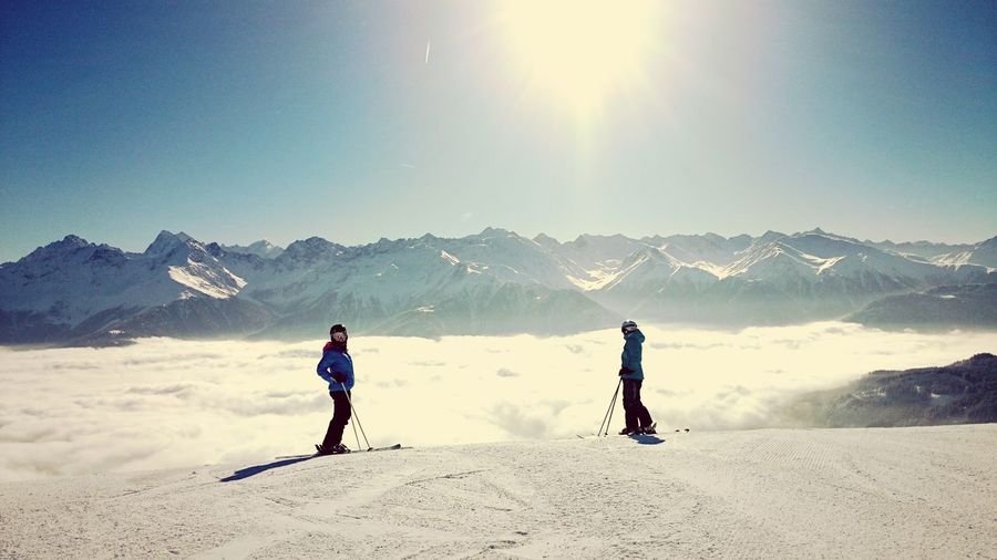 Two people on ski slope