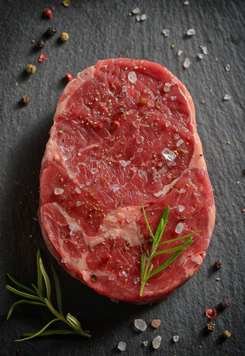 Directly above shot of raw marbled meat steak on slate