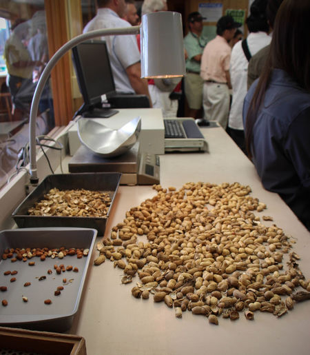 High angle view of peanuts on texting counter at store