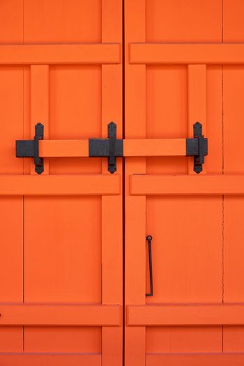 Full frame shot of orange buddhist temple gate