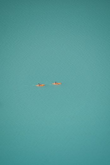 High angle view of airplane flying over sea