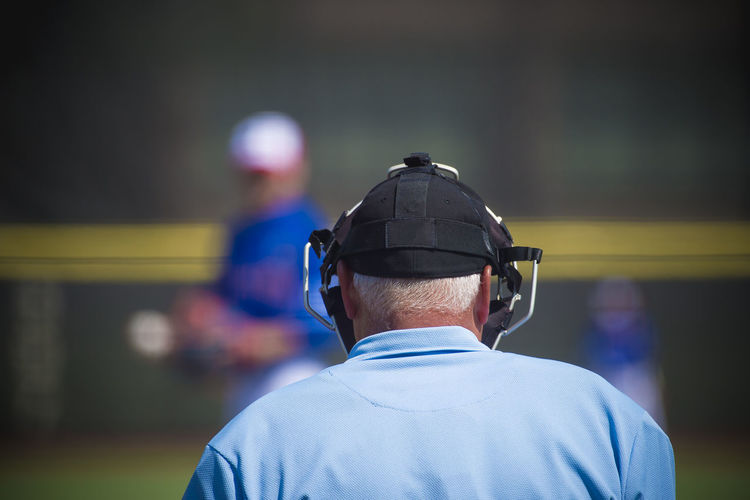 Rear view of referee on baseball field