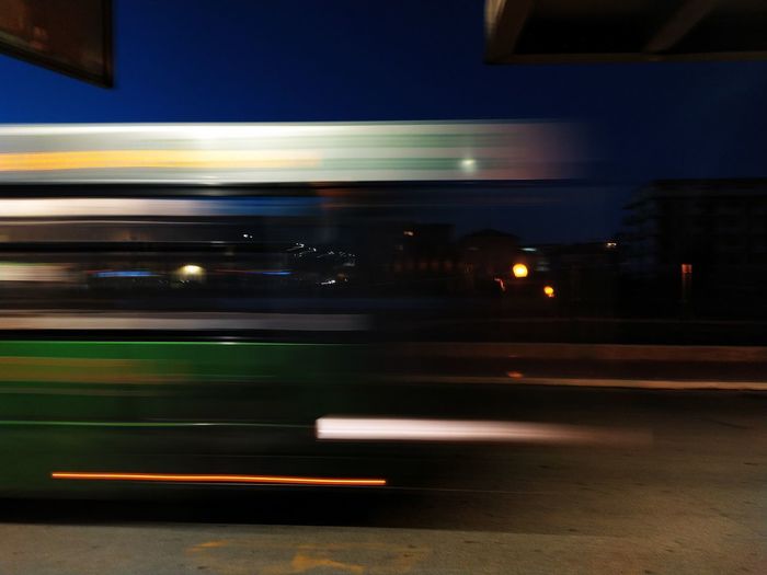 Blurred motion of train in city at night