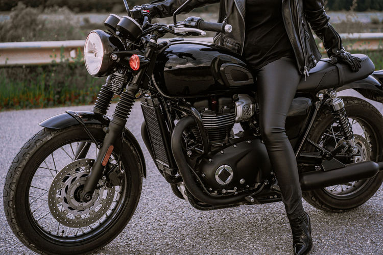 Low section on woman sitting on motorcycle