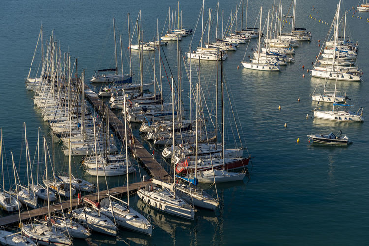 Boats moored at harbor