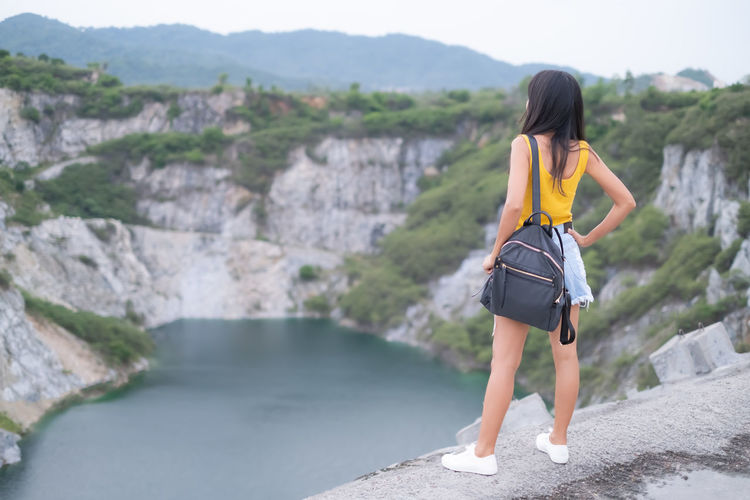 Alone woman standing on blur view landscape  mountain and river at grand canyon chonburi thailand.